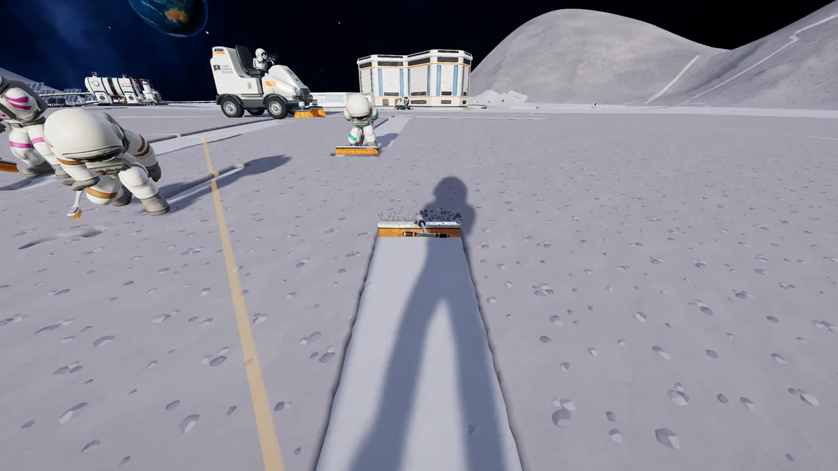 Moon Sweepers screenshot showing a first-person brush clearing a clean strip across the lunar surface.